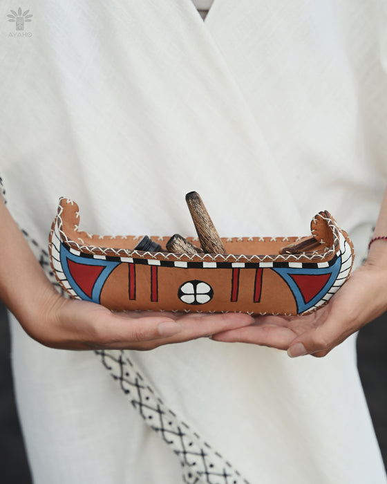 "Unique buffalo leather bag with boat-inspired design, perfect for carrying kuripe, snuff, and sacred tools.