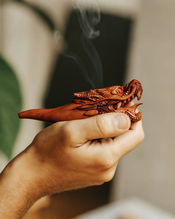 Elegant wood smoking pipe with a dragon design, providing a relaxing smoking experience.