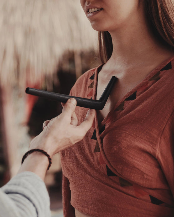 Traditional tepi pipe surrounded by ritual accessories, emphasizing authentic craftsmanship and spiritual purpose
