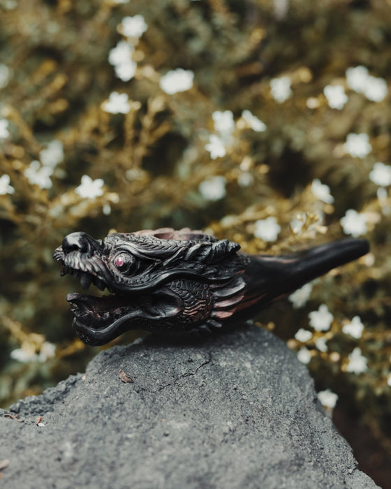 Ideal gift for smokers, this black wood dragon smoking pipe combines beauty and functionality.