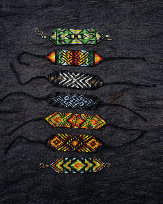 Handwoven bead loom bracelets with Ayahuasca-inspired tribal patterns, combining shamanic tools and talisman amulets for spiritual adornment