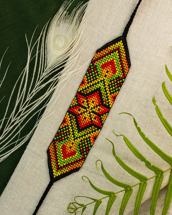 Handwoven bead loom bracelets with Ayahuasca-inspired tribal patterns, combining shamanic tools and talisman amulets for spiritual adornment