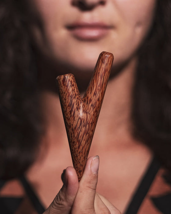 Coconut wood kuripe captured in natural lighting, highlighting its rich colors and textures