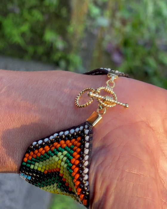 Handwoven bead loom bracelets with Ayahuasca-inspired tribal patterns, combining shamanic tools and talisman amulets for spiritual adornment