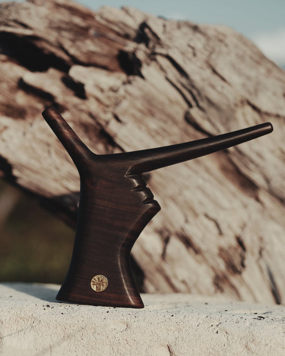 Artisan craftsmanship evident in the Hand-Shaped Tepi 2D made from rosewood, a true work of art.