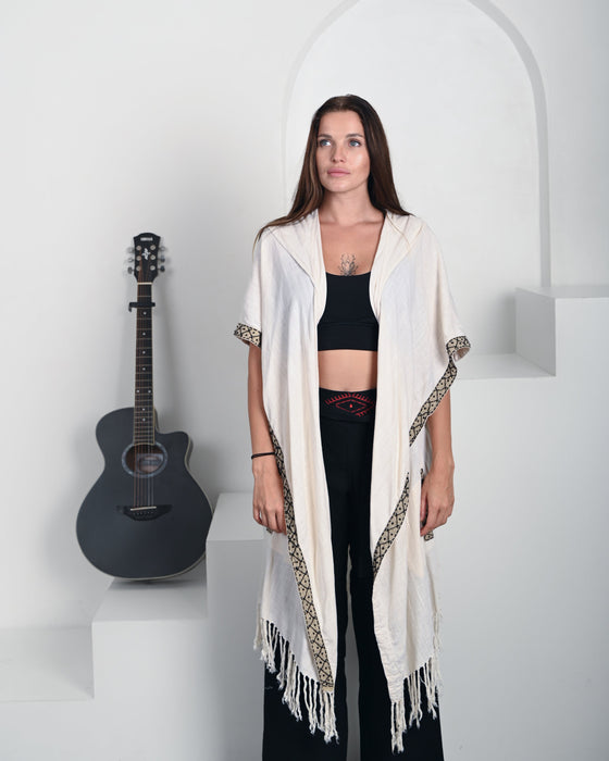 Artisan-crafted poncho in boho style, made from premium natural fabrics with intricate tribal patterns – perfect for spiritual practices and outdoor gatherings.