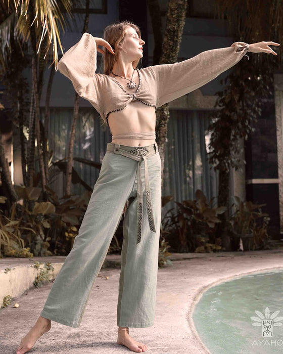 Detail of unisex boho organic cotton pants featuring a distinctive sacred geometry pattern on the belt, handcrafted for a blend of style and comfort in bohemian fashion