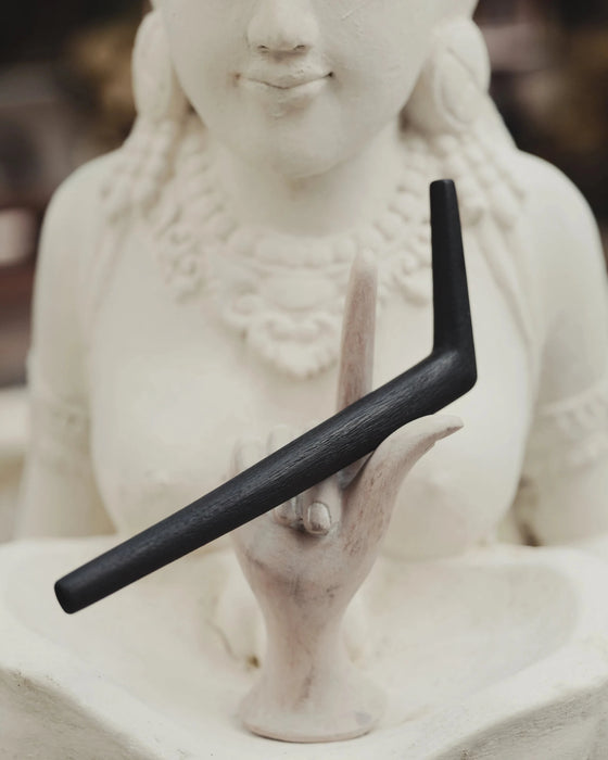 Traditional tepi pipe surrounded by ritual accessories, emphasizing authentic craftsmanship and spiritual purpose