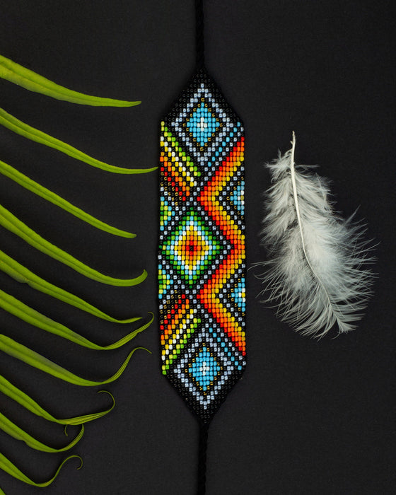 Handwoven bead loom bracelets with Ayahuasca-inspired tribal patterns, combining shamanic tools and talisman amulets for spiritual adornment
