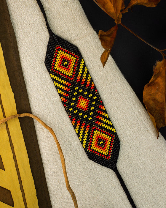 Handwoven bead loom bracelets with Ayahuasca-inspired tribal patterns, combining shamanic tools and talisman amulets for spiritual adornment