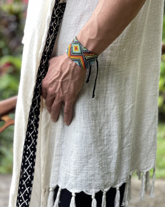 Handwoven bead loom bracelets with Ayahuasca-inspired tribal patterns, combining shamanic tools and talisman amulets for spiritual adornment