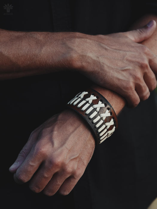 Handmade buffalo leather cuff with wide, bold design, symbolizing strength, spirituality, and ancestral connection.