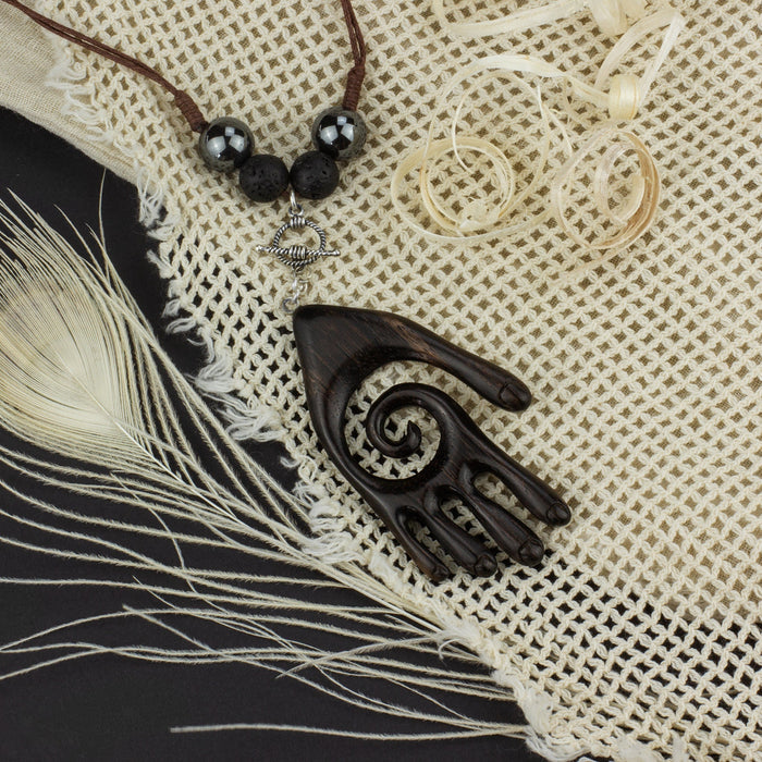 Handcrafted tribal jewelry set displayed on natural woven fabric