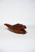 Wooden dragon-shaped object on a white background