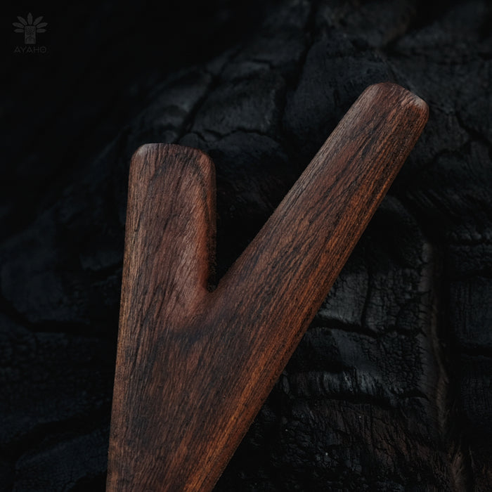 Wooden tool on a dark textured background