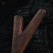 Wooden tool on a dark textured background