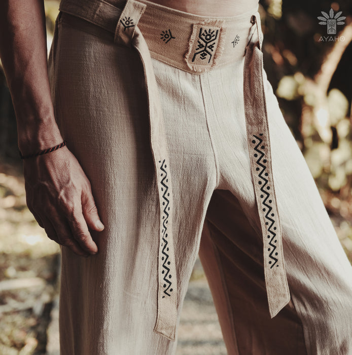 Traditional pants with intricate patterns on a blurred natural background
