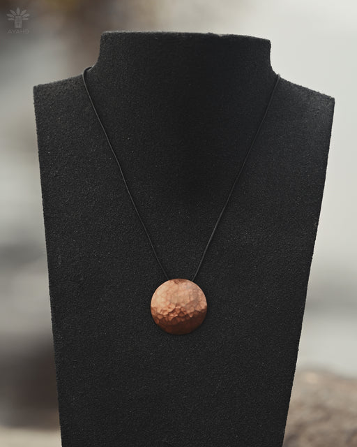 Handcrafted copper mirror designed to act as a barrier against negative energies during spiritual work.