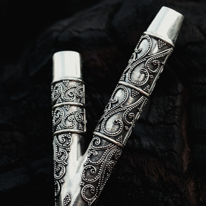 Ethnically patterned kuripe of silver