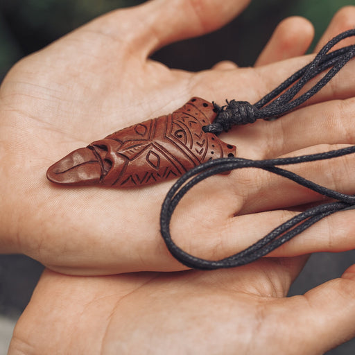 Handcarved sono wood amulet with intricate patterns, Protector Spirit  talisman on a leather cord for luck and protection