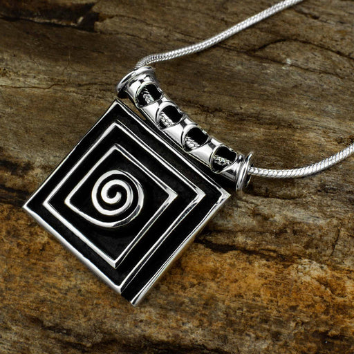 Handcrafted 925 sterling silver pendant with a spiral design symbolizing the path of life, creating a powerful talisman amulet