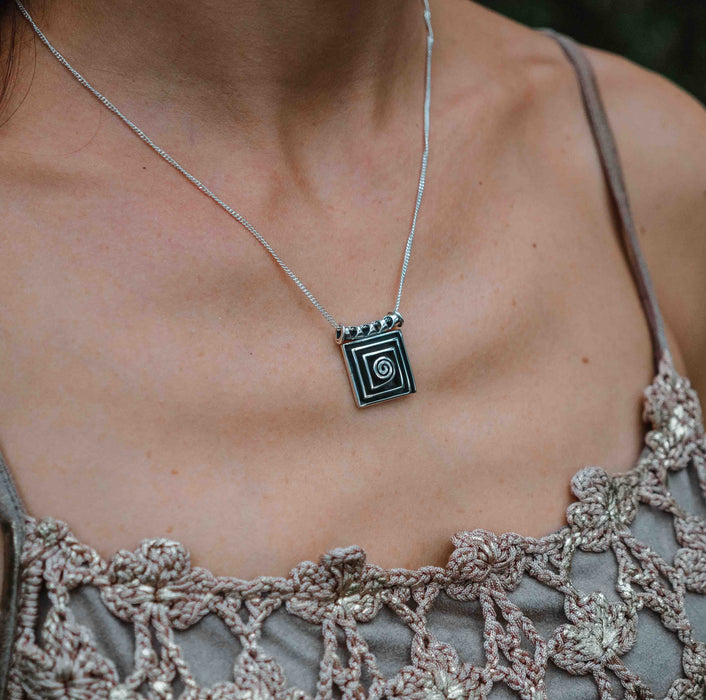 Handcrafted 925 sterling silver pendant with a spiral design symbolizing the path of life, creating a powerful talisman amulet