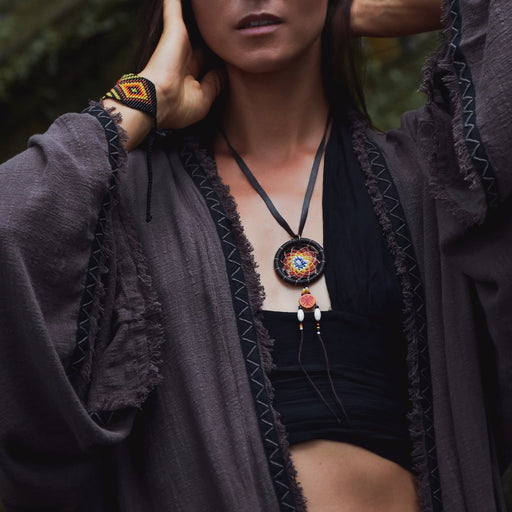 Embrace protection and style with our Ethnic-Styled Dream Catcher Amulet, handcrafted from goatskin leather. A blend of shamanic wisdom and Boho elegance, it's the perfect spiritual accessory. 