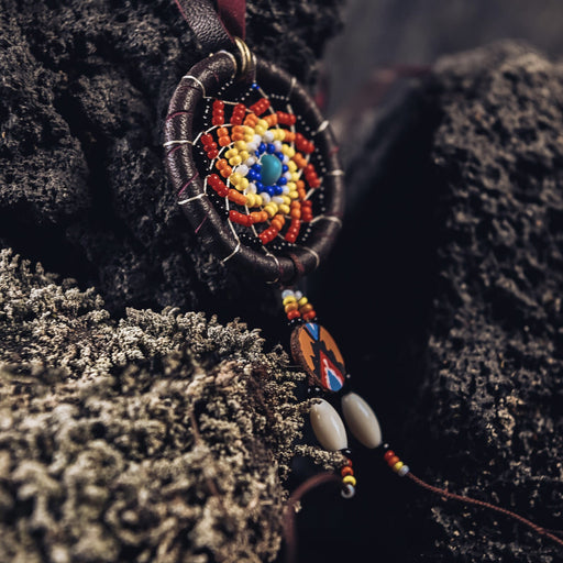 Embrace protection and style with our Ethnic-Styled Dream Catcher Amulet, handcrafted from goatskin leather. A blend of shamanic wisdom and Boho elegance, it's the perfect spiritual accessory. 