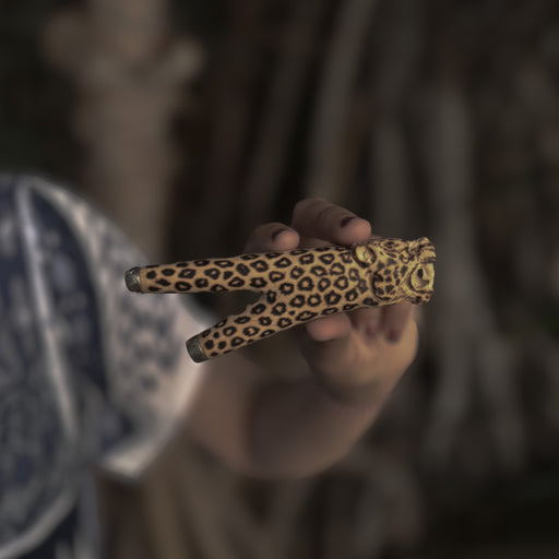 Artisan-crafted kuripe pipe featuring a jaguar totem, designed for Hape rituals.