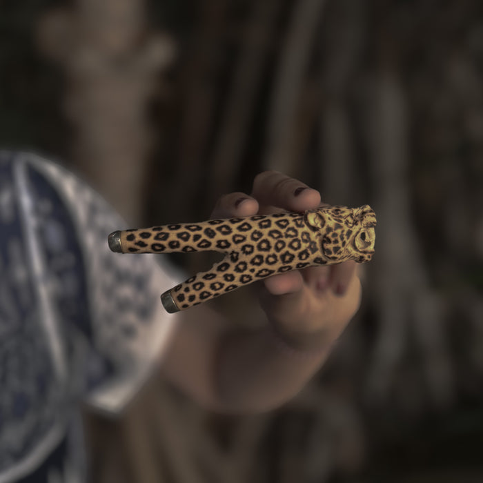 Artisan-crafted kuripe pipe featuring a jaguar totem, designed for Hape rituals.