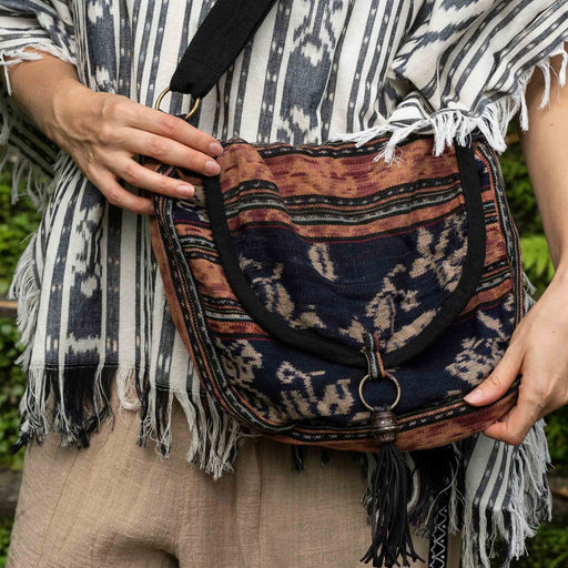 Channel the earthy spirit with this brown shamanic boho bag, a fusion of function and ethnic flair. Ideal for festivals or daily wear, this vintage-inspired piece is a versatile accessory for any modern shaman.