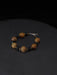 Bracelet with wooden beads on a dark background