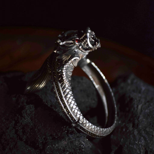 Embrace ancient wisdom and protection with our Bali Dragon Amulet Bracelet, a symbol of strength and guardianship inspired by Balinese culture. Crafted from raw silver, it's a spiritual tool and elegant accessory in one. 