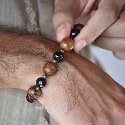 Artisan ethnic bracelet with agarwood and agate stones, featuring a sterling silver Bali clasp, designed as a ceremonial talisman for spiritual practice