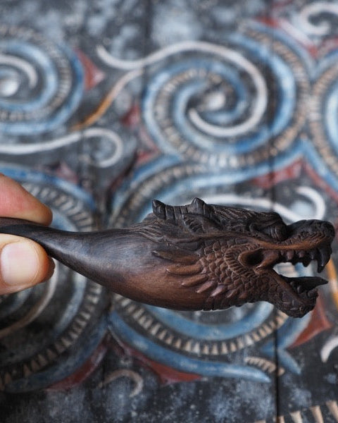 Enhance your smoking collection with this beautifully crafted black wood dragon smoking pipe.