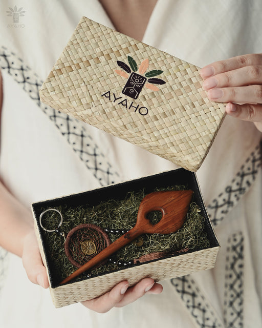 Artisan-made hairpin featuring a smooth teak wood leaf, shown accentuating a messy bun with natural earthy charm."