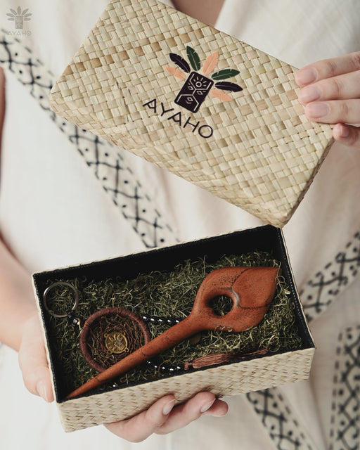 Artisan-crafted hairpin featuring a slender acacia wood leaf design, shown securing a loose updo with effortless elegance.