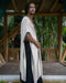 Model wearing a handmade tribal-style cotton kimono poncho with shamanic ornament, suitable for festivals and rituals