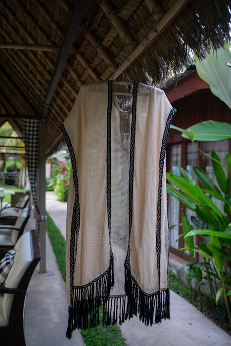 Eco-conscious boho poncho for men and women with unique hand embroidery and relaxed free-size fit