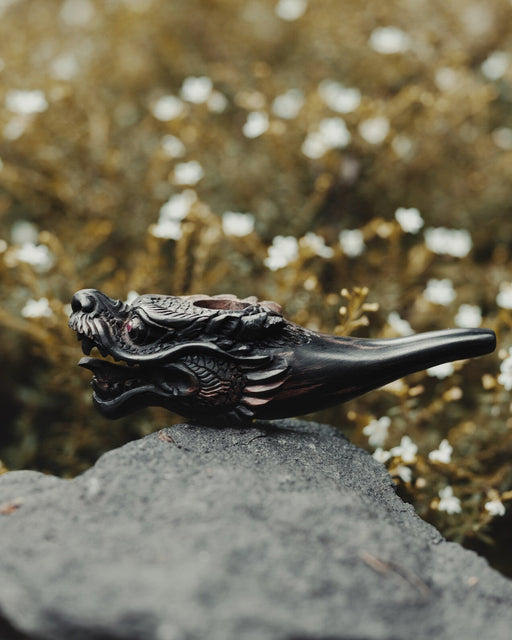 Hand carved wooden tobacco pipe, a shamanic tool for mapacho, displayed on driftwood—ideal for ceremonial use and a unique gift for smoking herbs