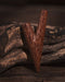 Coconut wood kuripe alongside hape snuff, illustrating its use in traditional ceremonies