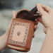 Leather pouch with belt clip for ceremonial tools and essentials.