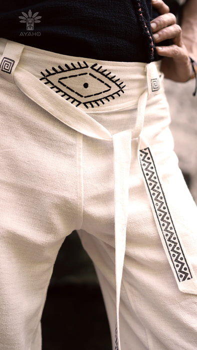 White pants with black embroidery and Ayaho branding.