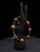 Bracelet with wooden beads on a black mannequin hand against a dark background