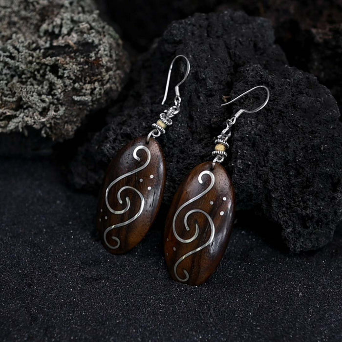 Handcrafted matching carved earrings set, embodying spiritual harmony, reflecting shamanic protection