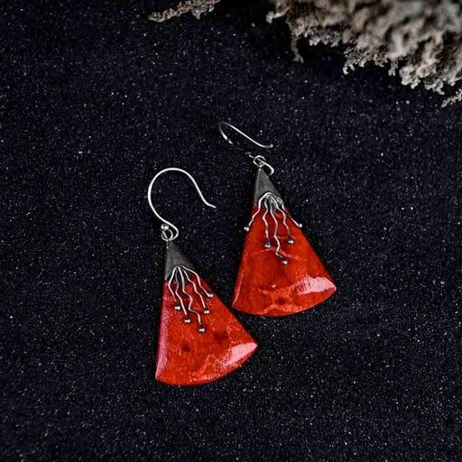 Vibrant handcrafted coral and silver earrings, representing the Awakening of Sacred Femininity imbued with energy and protection