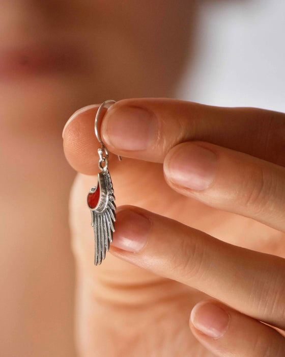 Elevate your style with our 'Wings of Wisdom' earrings, featuring red coral inserts and sterling silver. Symbolizing femininity and spiritual freedom, these elegant wings offer protection and grace.
