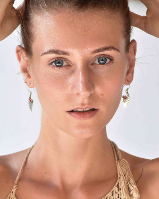Elevate your style with our 'Wings of Wisdom' earrings, featuring red coral inserts and sterling silver. Symbolizing femininity and spiritual freedom, these elegant wings offer protection and grace.