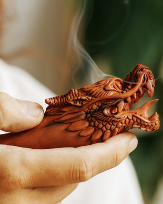 Elegant wood smoking pipe with a dragon design, providing a relaxing smoking experience.