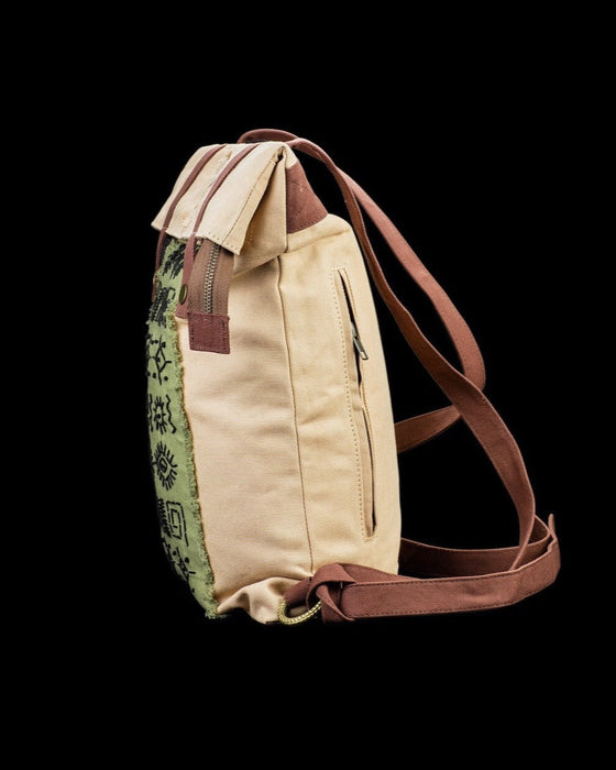 Artisanal ethnic style backpack crafted from natural canvas, featuring distinctive embroidery for the bohemian spirit, ideal for daily ventures and festivals